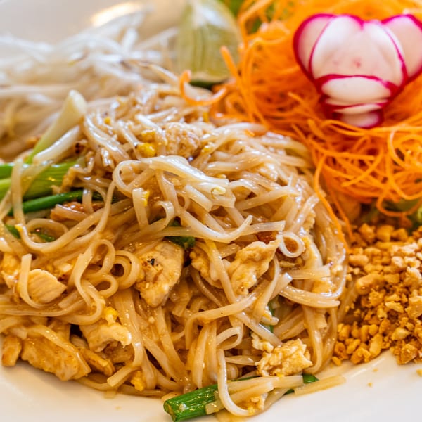 Close-up of Thai Won On's Pad Thai with chicken, peanuts, and shredded carrots.