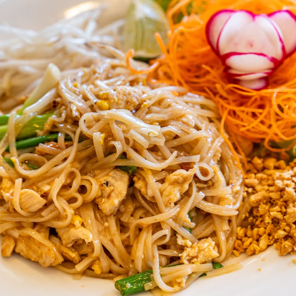 Close-up of Thai Won On's Pad Thai with chicken, peanuts, and shredded carrots.