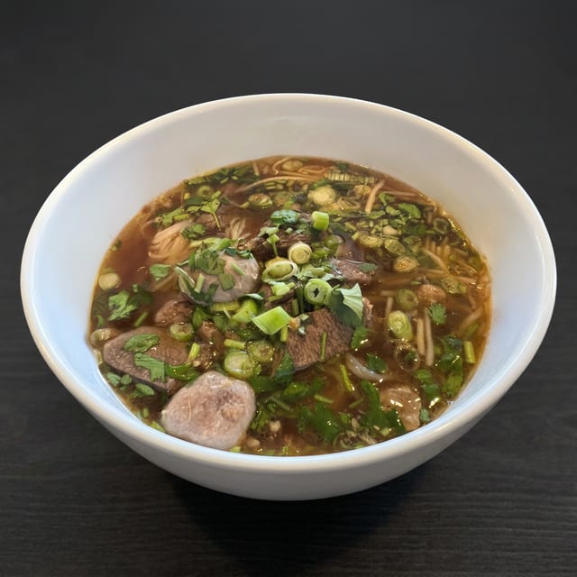 Thai Noodle Soup served with 1 Crispy Veg Roll.