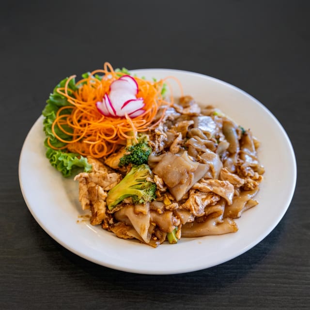 Pad See Ew served with 1 Crispy Veg Roll.