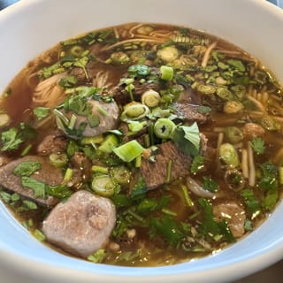 Thai Noodle Soup served with 1 Crispy Veg Roll
